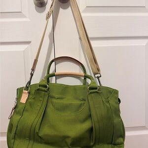 Danzo Diaper Bag in Green and tan with multiple compartments inside